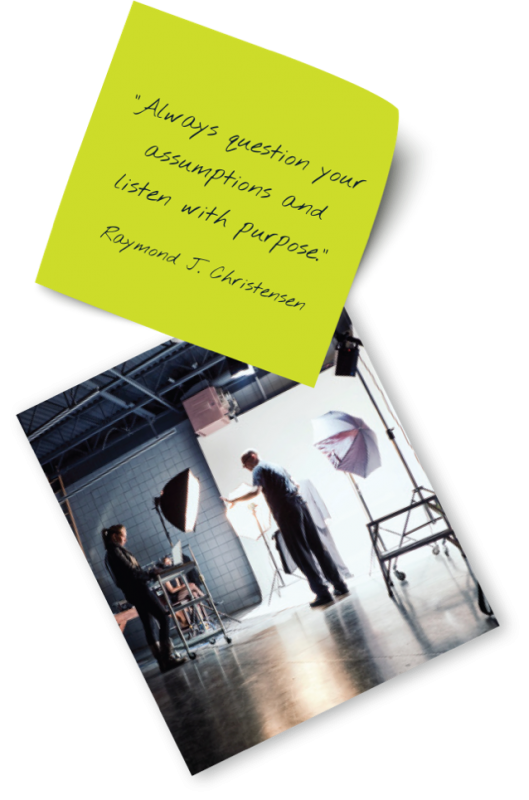 Scattered images: A sticky note with quote (Always be curious. Never lose your sense of wonder.) alongside a photo of a production set with silhouetted man adjusting light.
